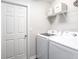 Laundry room with washer and dryer, and built-in shelving at 2210 Oldham Ct, Haines City, FL 33844