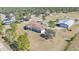 Aerial view of the property, showing the house and outbuildings at 2455 Gerber Dairy Rd, Winter Haven, FL 33880