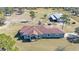 Aerial view of a ranch-style home with detached barn and expansive land at 2455 Gerber Dairy Rd, Winter Haven, FL 33880