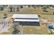 Aerial view of barn with covered stalls and outdoor space at 2455 Gerber Dairy Rd, Winter Haven, FL 33880