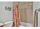 Clean bathroom with a tub shower and patterned shower curtain at 2455 Gerber Dairy Rd, Winter Haven, FL 33880