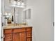 Bright bathroom with double vanity and large mirror at 2455 Gerber Dairy Rd, Winter Haven, FL 33880