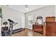 Bedroom with a treadmill and antique dresser at 2455 Gerber Dairy Rd, Winter Haven, FL 33880