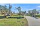 Gated entrance with stone pillars and signage leading to a home at 2455 Gerber Dairy Rd, Winter Haven, FL 33880