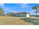 Side view of the house showcasing a two-car garage at 2455 Gerber Dairy Rd, Winter Haven, FL 33880