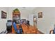 Spacious home office with wood desk and view into adjacent room at 2455 Gerber Dairy Rd, Winter Haven, FL 33880