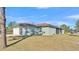 Side view of house with garage and screened patio at 2455 Gerber Dairy Rd, Winter Haven, FL 33880