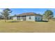 Rear view of house with screened patio at 2455 Gerber Dairy Rd, Winter Haven, FL 33880