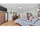 Main bedroom with king bed, wood furniture, and TV at 2455 Gerber Dairy Rd, Winter Haven, FL 33880