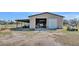 Spacious workshop with large roll-up door and covered area at 2455 Gerber Dairy Rd, Winter Haven, FL 33880