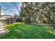 Large backyard with mature trees and screened patio at 3116 Hawks Ridge Dr, Lakeland, FL 33810