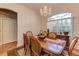 Bright dining room featuring a large wood table and chandelier at 3116 Hawks Ridge Dr, Lakeland, FL 33810