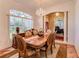 Formal dining room with hardwood floors, chandelier and view to home office at 3116 Hawks Ridge Dr, Lakeland, FL 33810