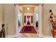 Elegant entryway with hardwood floors and decorative columns at 3116 Hawks Ridge Dr, Lakeland, FL 33810