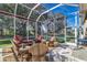 Relaxing screened patio furnished with wicker furniture at 3116 Hawks Ridge Dr, Lakeland, FL 33810