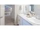 Bright bathroom with double vanity and marble countertop at 3130 Laurel Oak Ln, Winter Haven, FL 33884