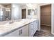 Bathroom with double vanity, marble countertop, and walk-in shower at 3142 Laurel Oak Ln, Winter Haven, FL 33884