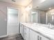 Double vanity bathroom with marble countertop and shower at 3142 Laurel Oak Ln, Winter Haven, FL 33884