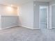 Upstairs hallway with carpet and access to bedrooms at 3142 Laurel Oak Ln, Winter Haven, FL 33884