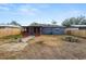 Large backyard with screened patio, firepit, and shed at 345 Piedmont Ct, Bartow, FL 33830