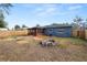 Large backyard with screened patio, firepit, and shed at 345 Piedmont Ct, Bartow, FL 33830