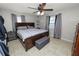 Spacious bedroom with a king-size bed, tiled floor, and ceiling fan at 345 Piedmont Ct, Bartow, FL 33830