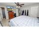 Main bedroom with a king-size bed, dresser, and access to a bathroom at 345 Piedmont Ct, Bartow, FL 33830