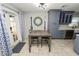 Cozy kitchen dining area with a small table and chairs near a door to a patio at 345 Piedmont Ct, Bartow, FL 33830