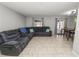 Living room with sectional sofa, dining area, and tile flooring at 345 Piedmont Ct, Bartow, FL 33830