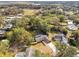 Aerial view of a house with a pool, showcasing the property and surrounding neighborhood at 3457 Christina Groves Ln, Lakeland, FL 33813