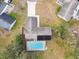 Aerial view showcasing home with pool and solar panels at 3457 Christina Groves Ln, Lakeland, FL 33813