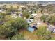 Aerial view of neighborhood with a house featuring a pool at 3457 Christina Groves Ln, Lakeland, FL 33813