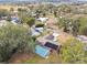 Aerial view of home showing pool, solar panels, and yard at 3457 Christina Groves Ln, Lakeland, FL 33813