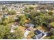 Aerial view of a house with a pool, showcasing the property and surrounding neighborhood at 3457 Christina Groves Ln, Lakeland, FL 33813