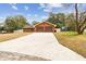 Two-car garage, long driveway, and a spacious yard at 3457 Christina Groves Ln, Lakeland, FL 33813