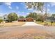 House exterior with a two-car garage and a yard at 3457 Christina Groves Ln, Lakeland, FL 33813