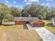 Ranch style home with a two-car garage and a well-maintained yard at 3457 Christina Groves Ln, Lakeland, FL 33813