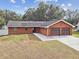 Ranch style home with double garage and mature trees at 3457 Christina Groves Ln, Lakeland, FL 33813