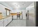 Galley kitchen with stainless steel appliances and light cabinets at 3457 Christina Groves Ln, Lakeland, FL 33813