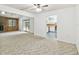 Open living room with kitchen access and view of backyard at 3457 Christina Groves Ln, Lakeland, FL 33813