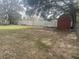 Backyard with shed, fence, and grassy area at 3638 W Wheeler Rd, Lakeland, FL 33810