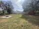 Backyard with firepit and shed at 3638 W Wheeler Rd, Lakeland, FL 33810