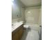 Bathroom with tub, vanity, and tile flooring at 3638 W Wheeler Rd, Lakeland, FL 33810