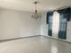 Dining room with tile floors and chandelier at 3638 W Wheeler Rd, Lakeland, FL 33810