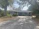 House exterior showing front yard, driveway, and landscaping at 3638 W Wheeler Rd, Lakeland, FL 33810