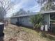 Exterior view of the house, showcasing gray siding at 3638 W Wheeler Rd, Lakeland, FL 33810