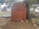 Red storage shed in the backyard at 3638 W Wheeler Rd, Lakeland, FL 33810