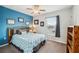 Charming bedroom with blue walls, a double bed, and a bookcase at 4235 Winding Vine Dr # 148, Lakeland, FL 33812