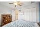 Bedroom with a double bed, built-in shelving, and access to a hallway at 4235 Winding Vine Dr # 148, Lakeland, FL 33812