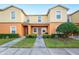 Two-story townhome with attractive landscaping and a welcoming entrance at 4235 Winding Vine Dr # 148, Lakeland, FL 33812